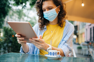 Portrait young woman wearing protective medical mask