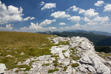 Hiking Velebit mountain in Croatia in summer, Velebit peaks Visibaba Kiza, Bacic kuk mountain rocks at Dabarski kukovi