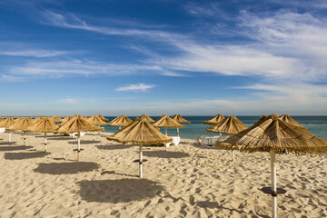 straw umbrellas on Galapa beach in Setúbal