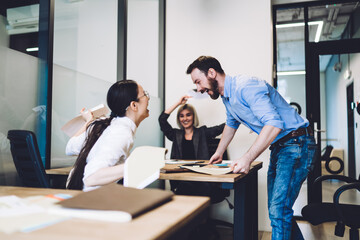Overjoyed burgeoning entrepreneurs rejoicing at office