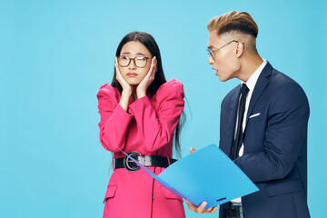 Outraged businessman shouts at the secretary and documents 