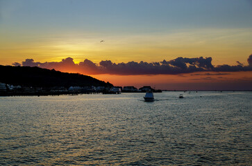 Sunset over the ocean colorful beautiful cloudscape.