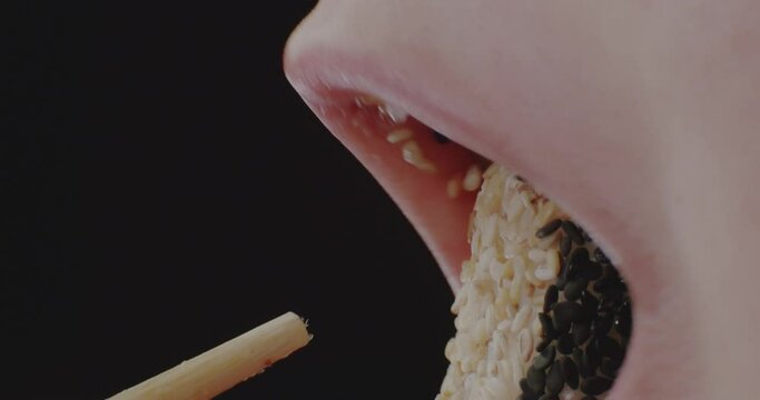 Macro. Eating Girl with Braces. Lips.