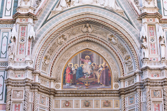 A beautiful decorative painting on panel above the entrance door at the Duomo Santa Maria del Fiore, (Cathedral of Saint Mary of the Flower) in Florence, Italy