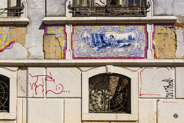 panels of polychrome azulejos on the walls of a beautiful ruined house in Setubal