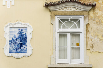 Fototapeta na wymiar panel of azulejos on a old house in Setubal, Portugal