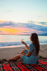 Woman laying on the beach enjoying summer holidays looking at the sea