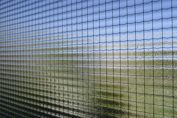 the sky and greenery visible through the frosted glass