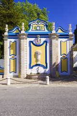 Vintage and colorful stone fountain in Azeitao village, Setubal, Portugal