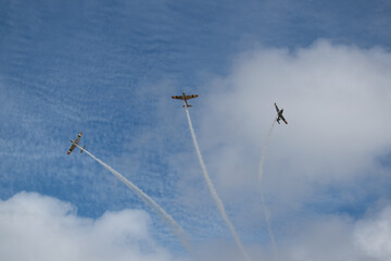 small retro aircrafts in blue sky