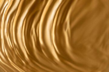 Fototapeta na wymiar Gold texture. Wavy surface.