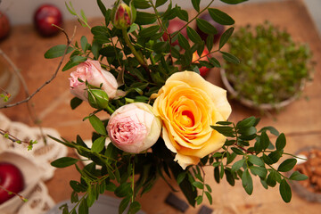 bouquet  wuth peony roses and apples in background