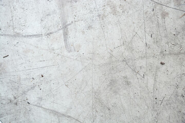 background of concrete floor, particles of dirt on the floor, storage room.