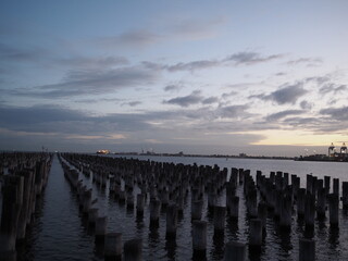 Sunset in the clouds at the Princess Pier in Port Melbourne, Victoria, Australia