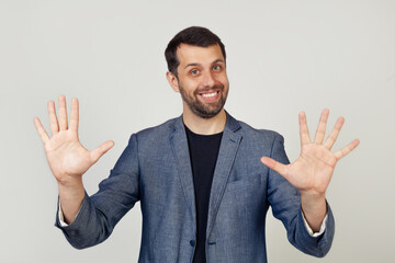 Young businessman man with beard smiling, showing number ten with fingers on his hand, smiling...