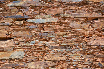 Architecture textures, detailed rusty and rustic old wall masonry schist