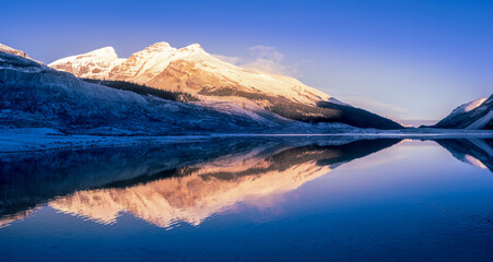 Fototapeta na wymiar Morning mountain reflected in the lake, Columbian Icefields Banff National park, Canada