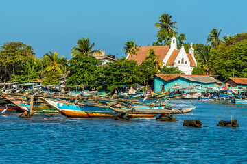 Traditional outrigger canoes moored in a tributary to the lagoon in Negombo, Sri Lanka © Nicola