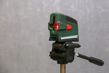 laser level on background of gray wall