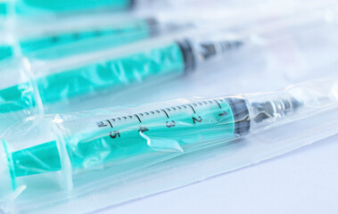Medical disposable syringes with needles in the package. Selective focus