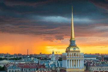 Saint Petersburg, Russia. Storm clouds on the horizon, beautiful cityscape in a thunderstorm at sunset. View of the Admiralty and the city