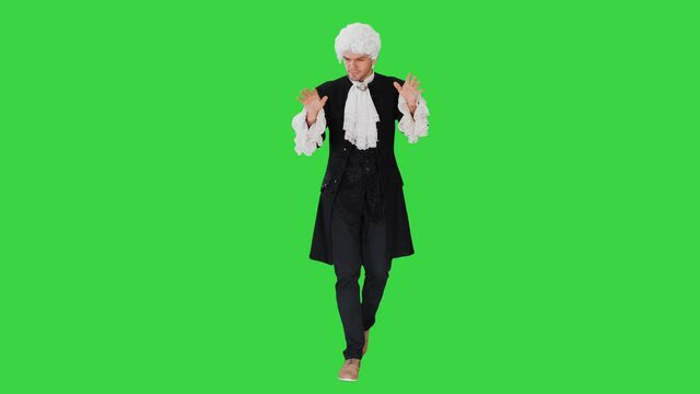 Man dressed like Mozart conducting while walking on a Green Screen, Chroma Key.
