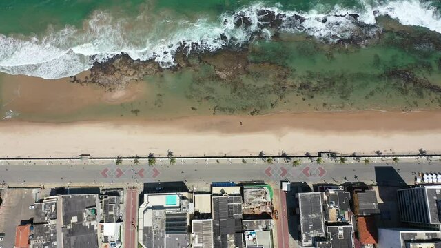 Seascape of paradisiac beach in Salvador, Bahia, Brazil. Beach scene. Beachfront view. Salvador, Bahia, Brazil. Beachfront scene. Seascape view. Seascape scene of beachfront. Paradisiac beach.