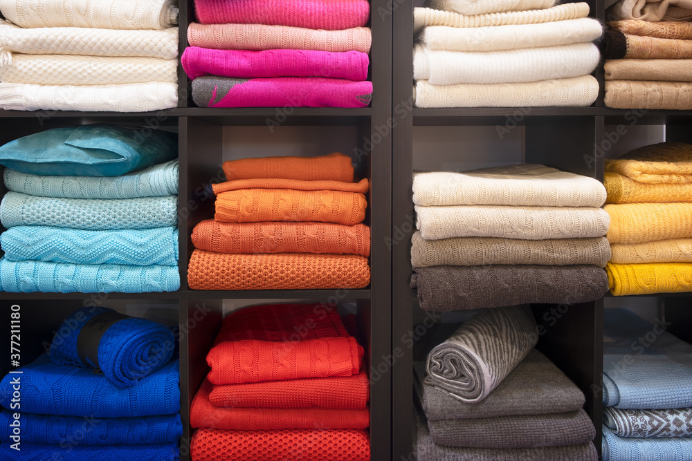 Poster Row of colorful clothes on shelf