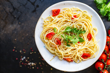 spaghetti pasta tomato salad vegetables macaroni semola durum wheat on the table serving size top view place copy space for text