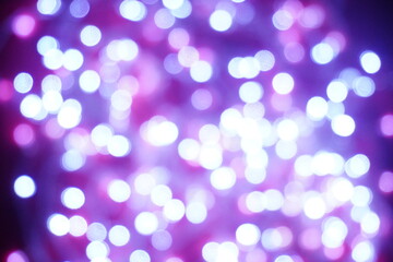 Blue lights on a purple background are blurred. Concept of blank frame,copy space. Christmas or new year flatlay background.