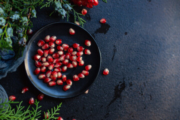 pomegranate sweet red fruit on the table new year treat christmas serving size top view copy space for text