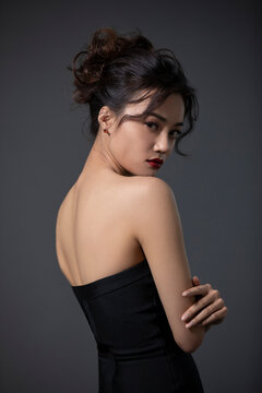 Beautiful young woman in black dress