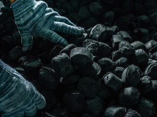 Coals mining - Man's hands in gloves holding natural black coal for background. Picture idea about...