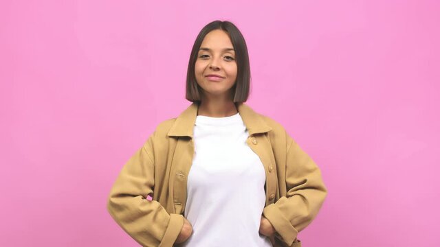 Young indian woman winking, funny joke, symbol of agreement or complicity
