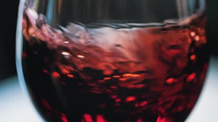 Wine swirling in a glass at wine tasting Slow Motion - Powered by Adobe