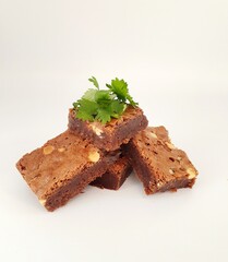 Homemade chocolate brownies on a white background.