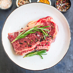 fresh steak rib eye meat beef juicy on the table serving portion size top view copy space for text