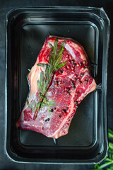 fresh steak rib eye meat beef juicy on the table serving portion size top view copy space for text