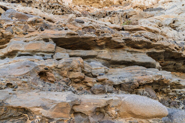 Limestone speckled by winds and storms. Background.