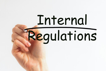 Hand writing Internal Regulations with marker, concept background