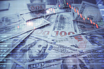 Multi exposure of forex chart drawing over us dollars bill background. Concept of financial success markets.