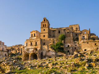 Fototapeta na wymiar Stunning view of Craco ruins, ghost town abandoned after a landslide, Basilicata region, southern Italy 