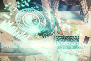 Double exposure of man and woman working together and business theme hologram drawing. Computer background. Top View.