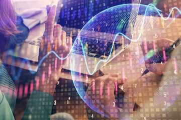 Fototapeta na wymiar Double exposure of man and woman working together and forex chart hologram. Business concept. Computer background.