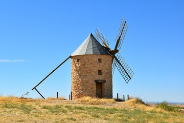 Fototapeta na wymiar Windmill built in stone and wood in Belmonte. Sunny day, blue sky.
