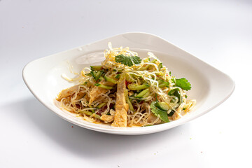 Transparent rice noodle salad with chicken is on the plate