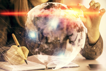 Multi exposure of woman on-line shopping holding a credit card and financial theme drawing....