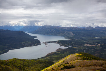 Beautiful View of a small Touristic Town, Carcross, surounded by Canadian Mountain Landscape. Located near Whitehorse, Yukon, Canada.