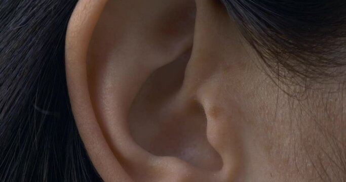 Close-up Female Ear. Outdoors Natural Lighting Morning Evening Time