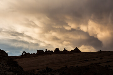 Landscape view of Arches National Park in Utah at sunset right after a thunderstorm (Utah).